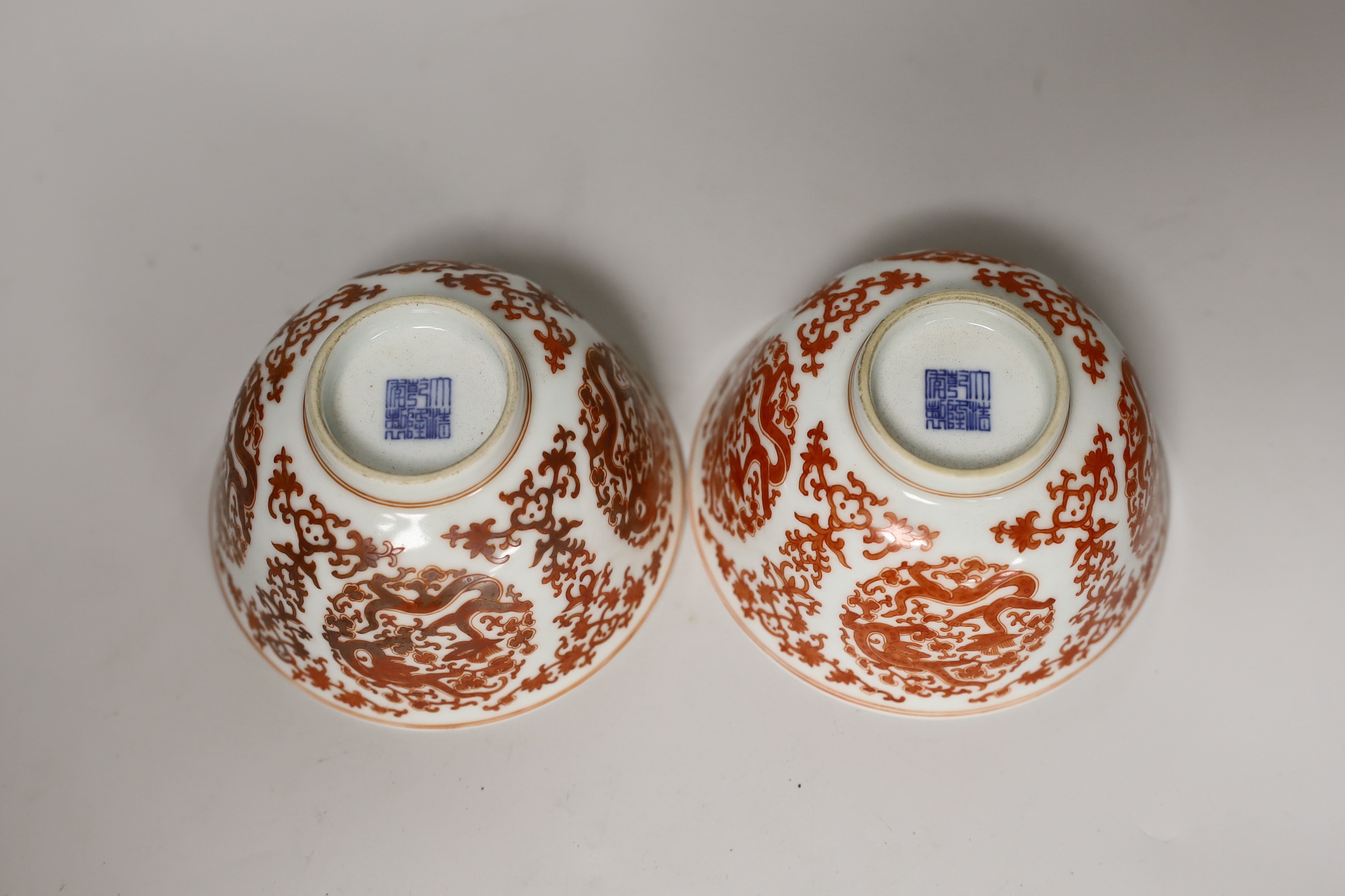 A pair of Chinese iron-red enamelled bowls, 11.5cm diameter